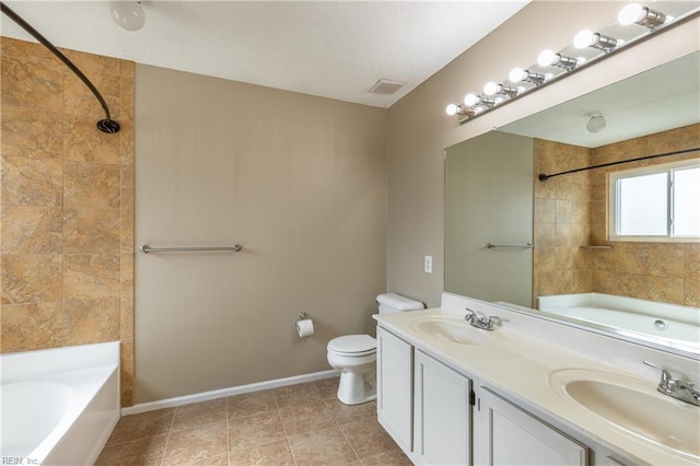 full bath featuring toilet, double vanity, baseboards, and a sink