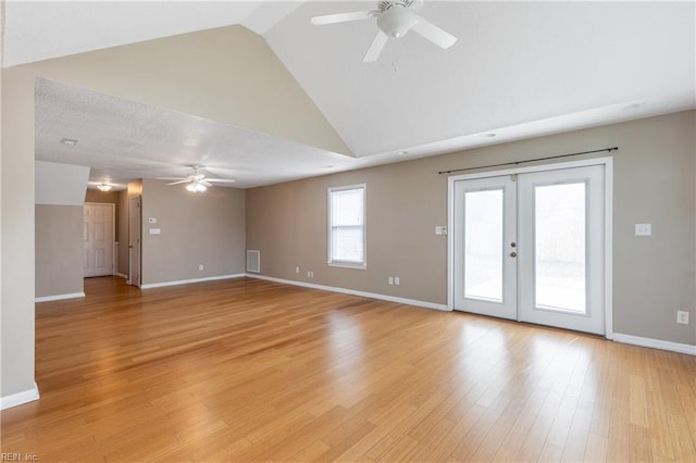 spare room featuring light wood-style floors, baseboards, visible vents, and a ceiling fan