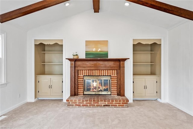 unfurnished living room featuring built in features, a fireplace, vaulted ceiling with beams, and carpet