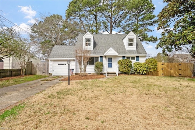 cape cod-style house featuring a front lawn, aphalt driveway, fence, roof with shingles, and an attached garage