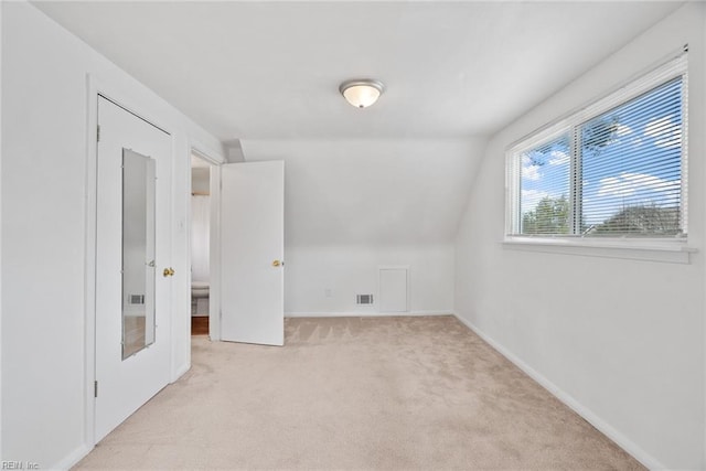 bonus room with vaulted ceiling, visible vents, baseboards, and carpet floors