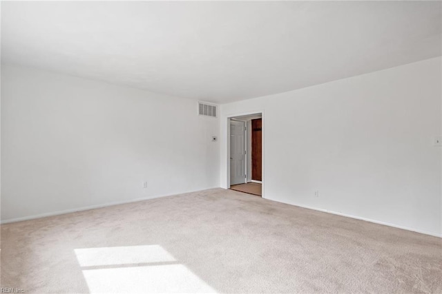 carpeted spare room with visible vents