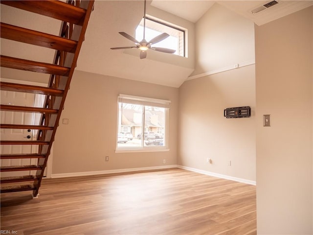 interior space with a healthy amount of sunlight, light wood-type flooring, visible vents, and a ceiling fan