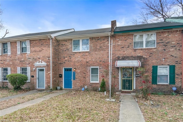 view of property featuring brick siding