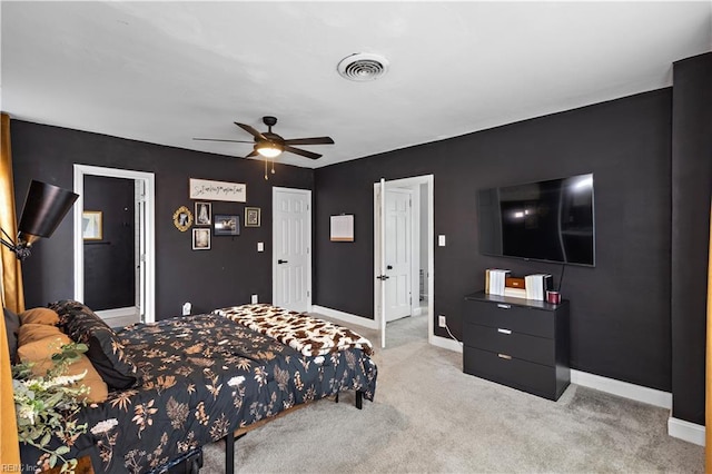 bedroom featuring a ceiling fan, carpet, visible vents, and baseboards