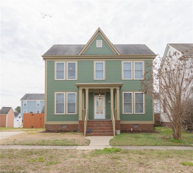 view of front of home with a front yard and crawl space