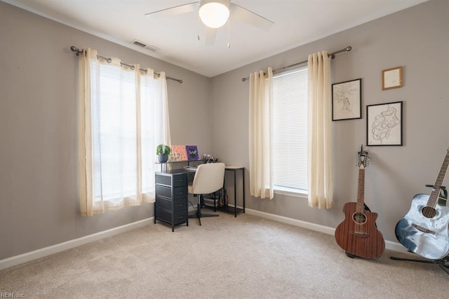 office area with carpet, plenty of natural light, and visible vents