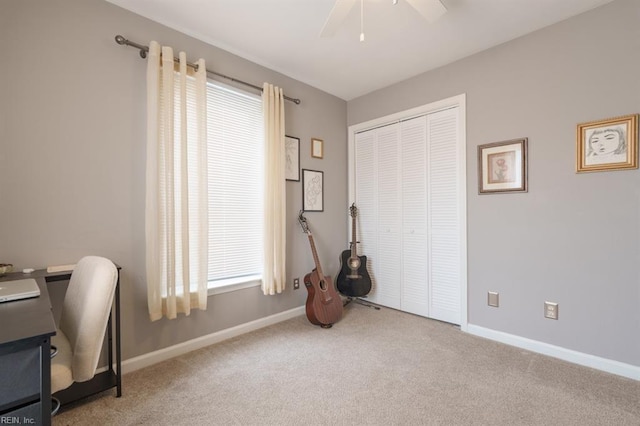 office with carpet floors, baseboards, and a ceiling fan