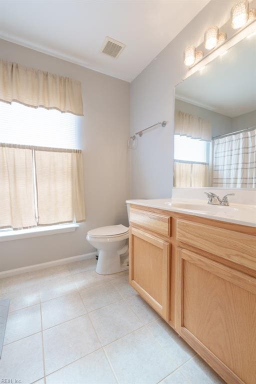 full bathroom with visible vents, toilet, vanity, tile patterned flooring, and baseboards