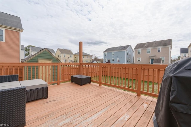 deck featuring fence and a residential view