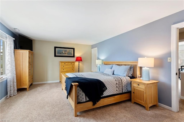 bedroom with visible vents, baseboards, and light colored carpet