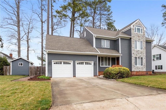 traditional-style house featuring a garage, fence, driveway, and a front lawn