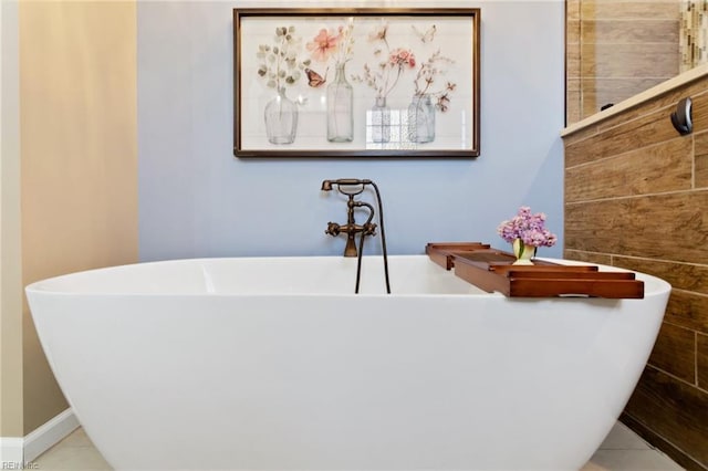 full bathroom with tile patterned flooring and a soaking tub