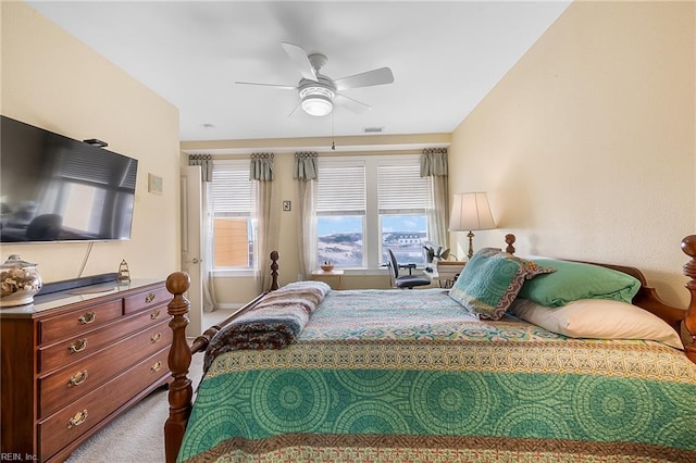 carpeted bedroom featuring ceiling fan and visible vents