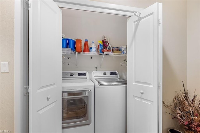 clothes washing area featuring laundry area and independent washer and dryer