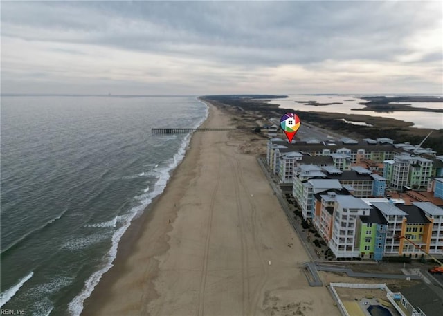 bird's eye view featuring a water view and a view of the beach