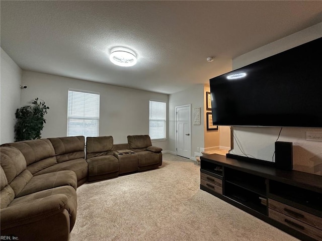 living room featuring baseboards, a textured ceiling, and light colored carpet