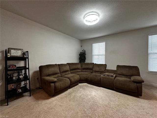 living room with light carpet and a textured ceiling