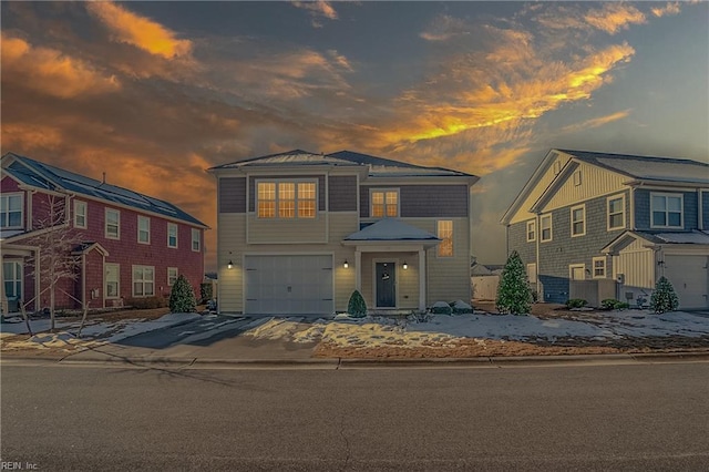 view of front of house featuring a garage and concrete driveway