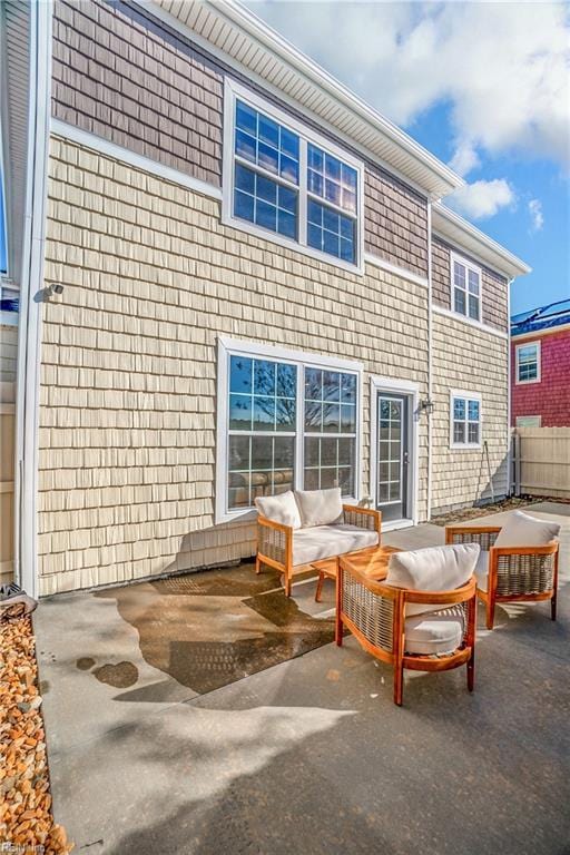 rear view of property featuring an outdoor hangout area and a patio