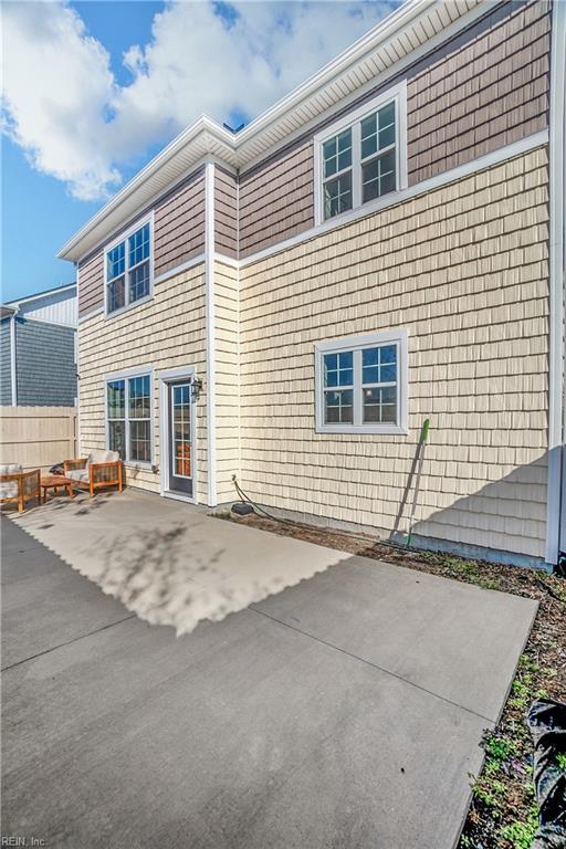 back of house with a patio area and fence