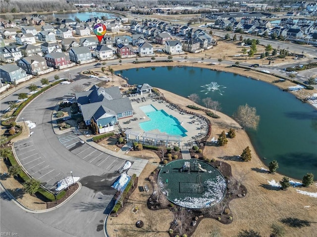 bird's eye view featuring a water view and a residential view