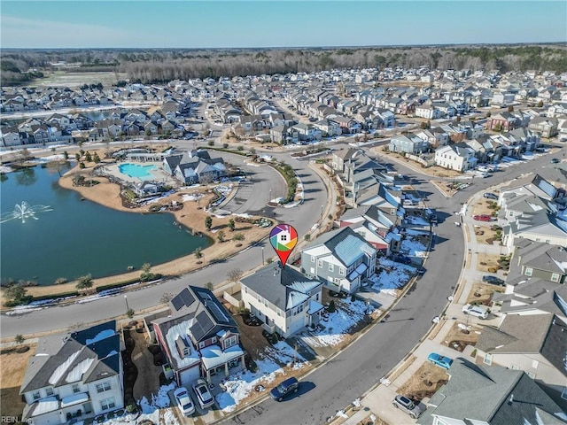 bird's eye view featuring a water view and a residential view