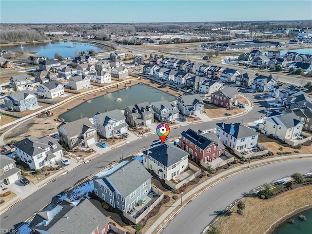 bird's eye view with a water view and a residential view