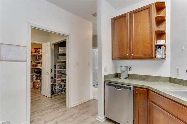 kitchen with light wood-style floors, brown cabinets, dishwasher, and open shelves