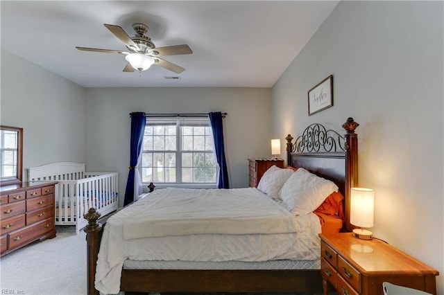 bedroom with multiple windows, carpet flooring, and a ceiling fan