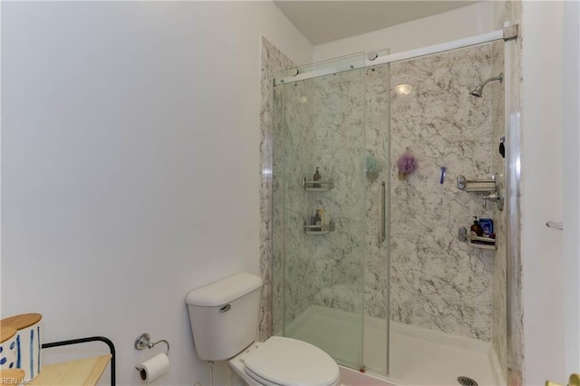 full bathroom featuring a marble finish shower and toilet