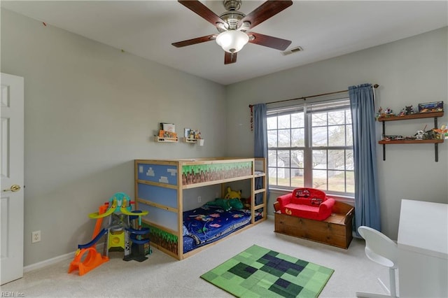 bedroom with baseboards, ceiling fan, visible vents, and carpet flooring