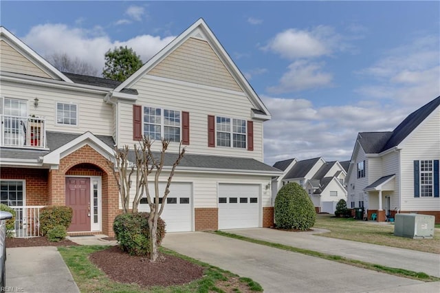 view of front of property with a garage, driveway, central AC, and brick siding