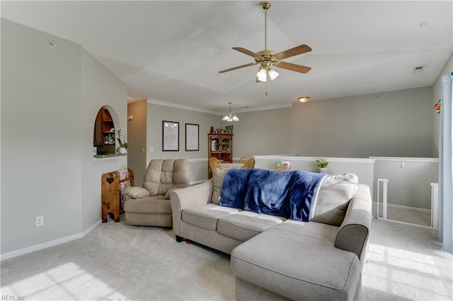 living room featuring light carpet, ceiling fan with notable chandelier, and baseboards