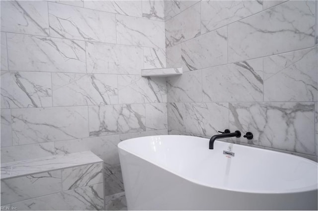 bathroom with a soaking tub