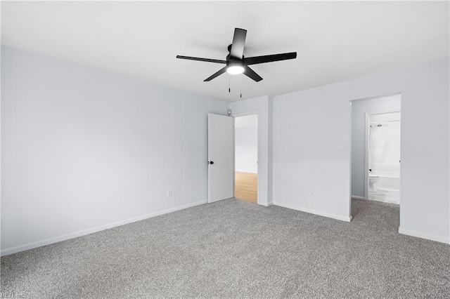 unfurnished bedroom with ceiling fan, carpet floors, and baseboards