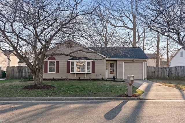 view of front of property with a garage, fence, a front lawn, and aphalt driveway