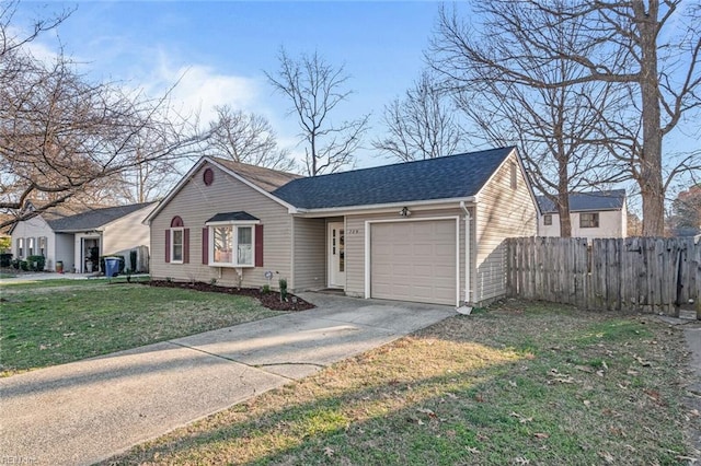 view of front of house with driveway, roof with shingles, an attached garage, fence, and a front lawn