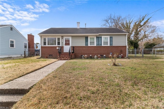 view of front of home with brick siding, fence, crawl space, a gate, and a front yard