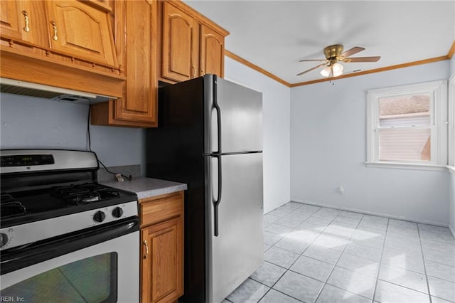 kitchen with under cabinet range hood, stainless steel appliances, a ceiling fan, ornamental molding, and brown cabinetry