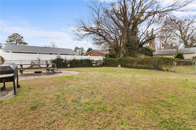 view of yard with a patio area and a fenced backyard