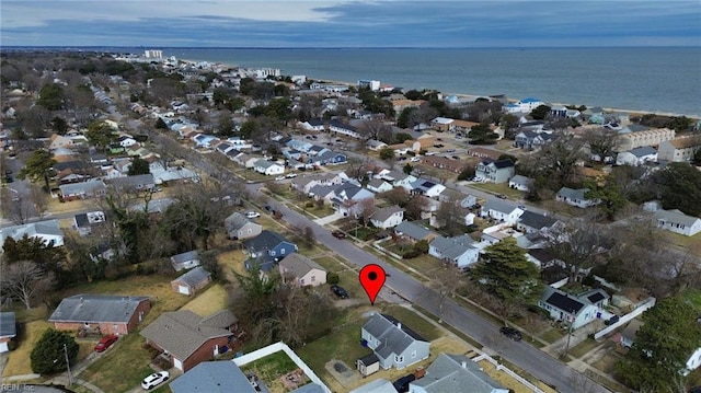 bird's eye view featuring a residential view and a water view