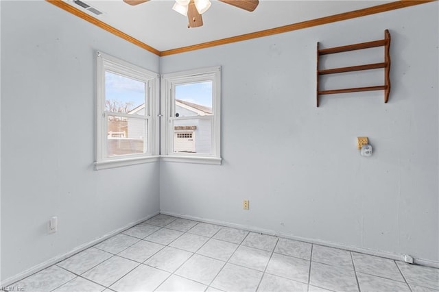 spare room featuring light tile patterned floors, baseboards, visible vents, ceiling fan, and crown molding