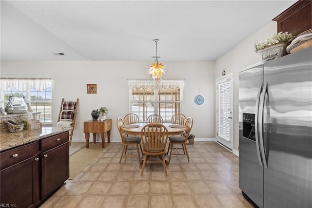 dining space with visible vents and baseboards