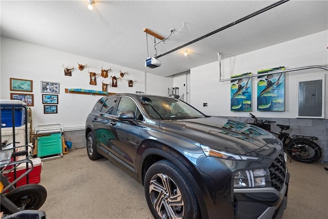 garage featuring electric panel and a garage door opener