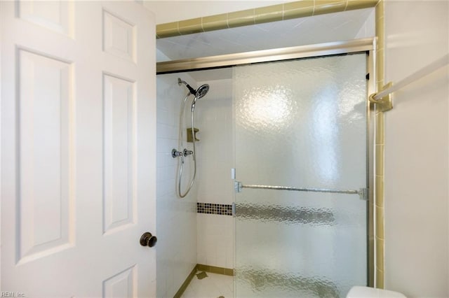 bathroom with a shower stall