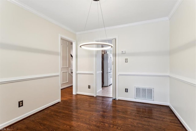 unfurnished dining area with baseboards, wood finished floors, visible vents, and crown molding