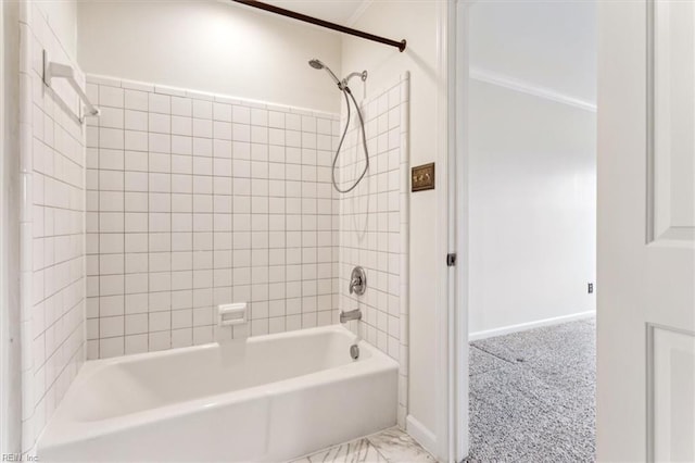 full bath with baseboards, ornamental molding, and shower / bathtub combination