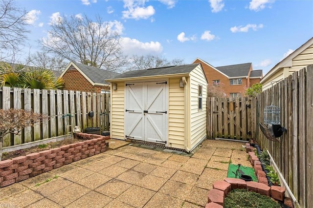 view of shed featuring a fenced backyard