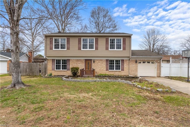 colonial home with a garage, brick siding, fence, driveway, and a front lawn